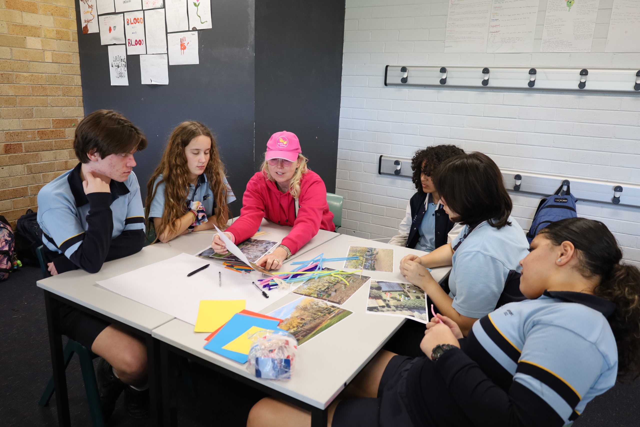 Touched by Olivia staff table facilitating with students